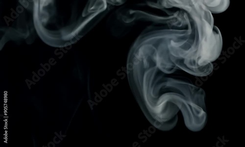White puff of smoke amidst a black background floating across the screen abstract convept