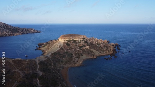 Qarraba Bay flat rock cape Malta, Aerial establishing shot in the morning sunlight. High quality photo