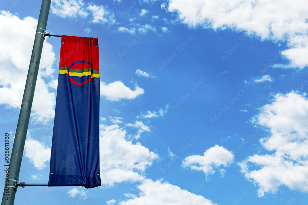Sami nation flag in Nordland, Norway. Sami flag is the flag of Sami people, one of the Indigenous people groups of the Nordic countries