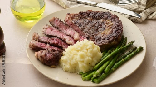 ribeye steak with asparagus and mushed potato