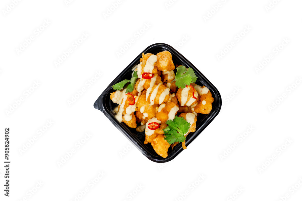 Crispy cauliflower bites drizzled with spicy sauce and garnished with herbs ready for takeout Crispy cauliflower bites drizzled with spicy sauce and garnished with herbs ready for takeout