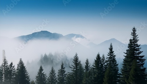 mountains pine trees in front of a misty sky soft blues grays create a peaceful setting