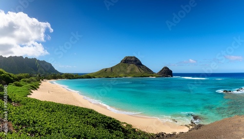 hidden beach with view of the mokes aka na mokulua with turquoise waters on a clear sunny day at lanikai beach on the windward side of oahu hawaii
