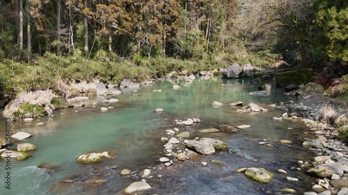 日本の風景 緑色の渓流と、苔のむした立派な岩をドローンで空撮 宮崎県の観光地