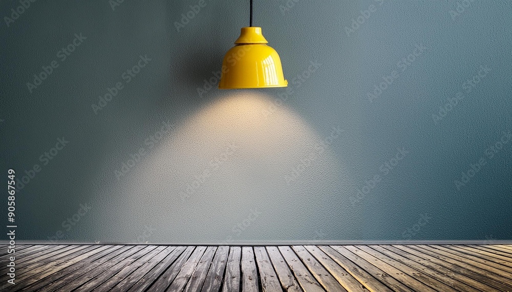 Gray wall with lighting from a metal yellow lamp Gray wall with lighting from a metal yellow lamp