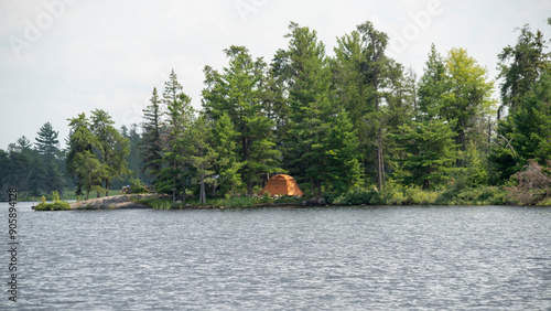 Lucky tent campers set up camp within the serene island in Lake Rainy in the Voyaguer National Park amongst the Boreal forest