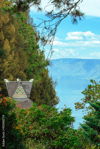 Aerial drone view of Toba Lake with blue water at Pangururan in Samosir Island, Sumatra Utara, Indonesia photo