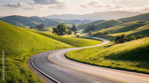 Highway winding through a picturesque landscape with rolling hills and green fields, capturing the beauty of rural travel and the open road 