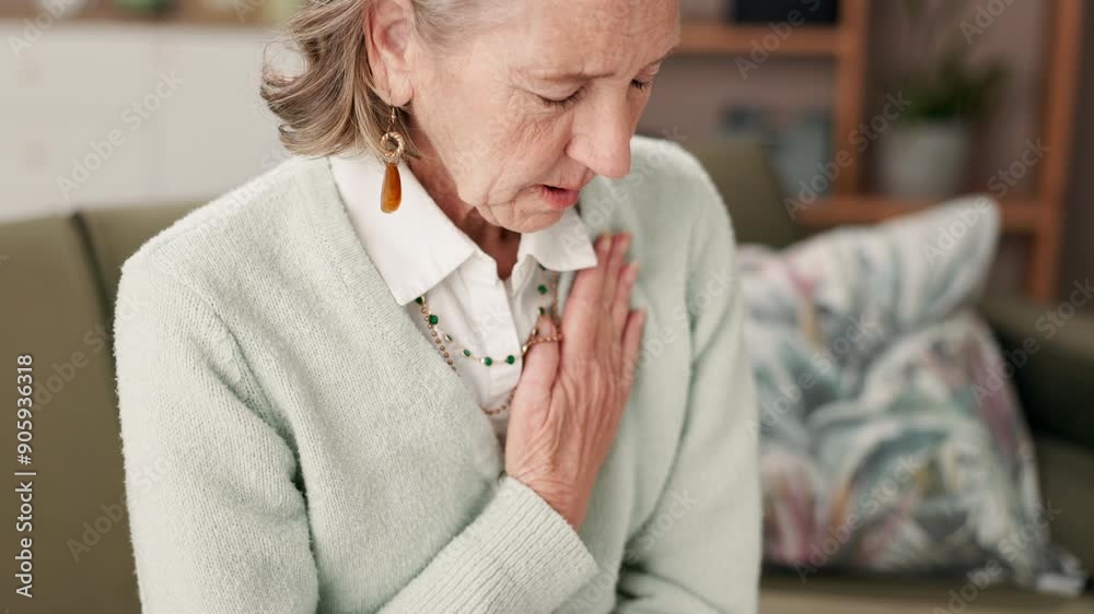 Senior, woman and couch with hands for chest pain in retirement home, heart attack signs and cardiac symptoms or angina. Old person, discomfort and shortness of breath for medical emergency on sofa.