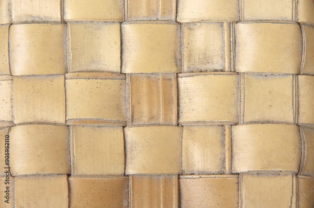 Mat brown texture with weaving handmade seamless patterns made from dried palm leaf on old background Mat brown texture with weaving handmade seamless patterns made from dried palm leaf on old background