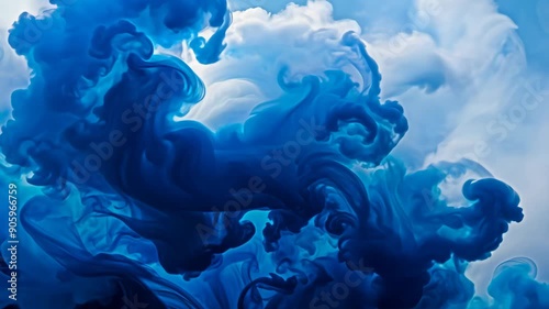 Blue ink swirling in water creating abstract