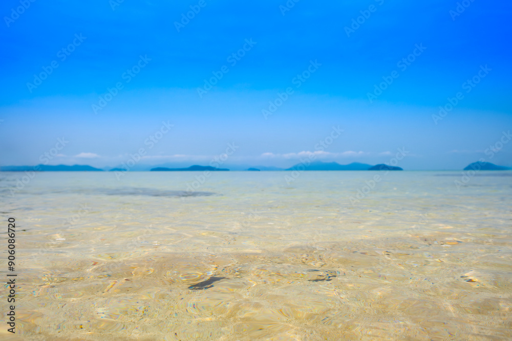 Nature of the beach and sea Summer with sunshine, sandy beaches, clear blue waters sparkling against the blue sky. On an island with good ecology and environment Background for summer vacation concept