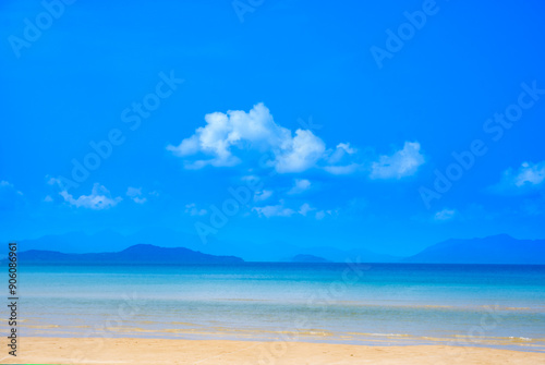 Fototapeta Naklejka Na Ścianę i Meble -  Nature of the beach and sea Summer with sunshine, sandy beaches, clear blue waters sparkling against the blue sky. On an island with good ecology and environment Background for summer vacation concept