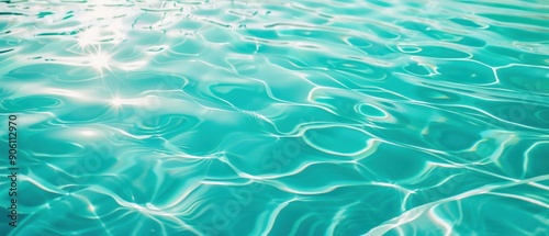 Gentle ripples on turquoise water, creating a peaceful and refreshing scene with subtle reflections