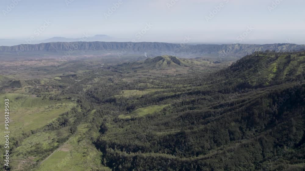 Aerial view of idyllic landscape in nature with mountains in the distance Aerial view of idyllic landscape in nature with mountains in the distance