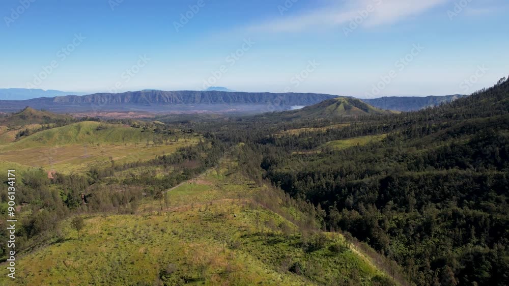 Aerial view of idyllic landscape in nature with mountains in the distance Aerial view of idyllic landscape in nature with mountains in the distance