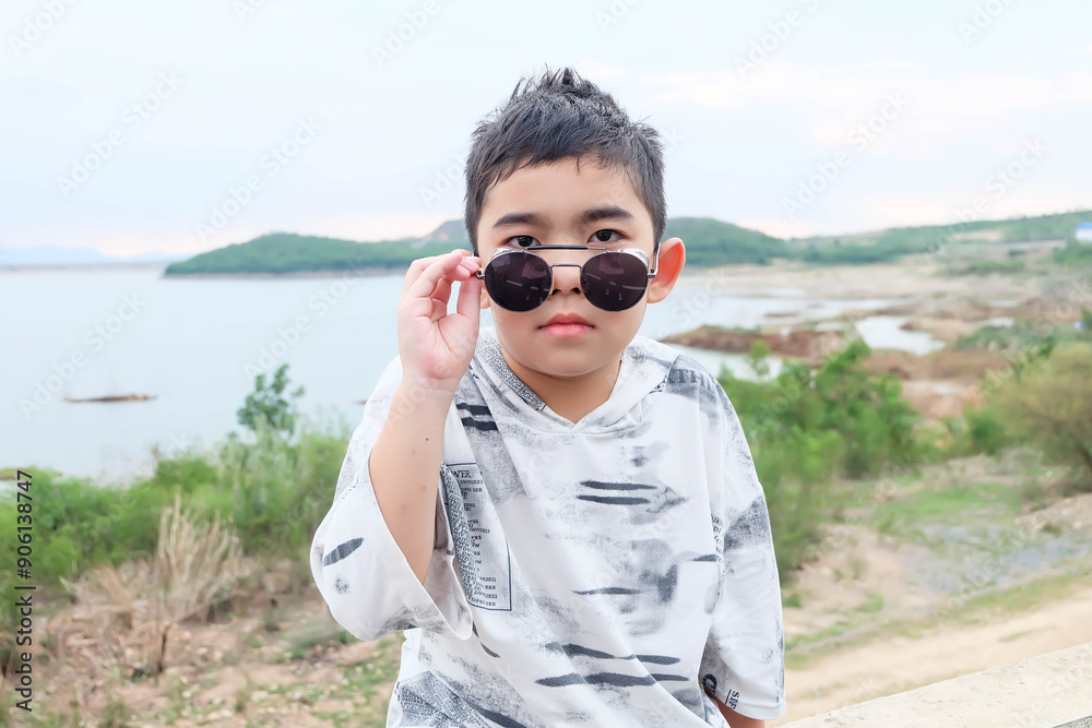 Cute boy with fashion black sunglasses. Cute boy with fashion black sunglasses.