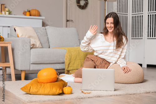 Young woman video chatting ...