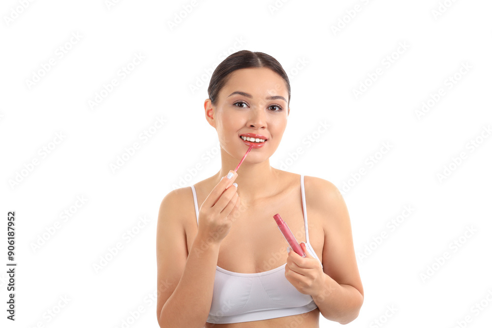 Young Asian woman with lip gloss on white background Young Asian woman with lip gloss on white background