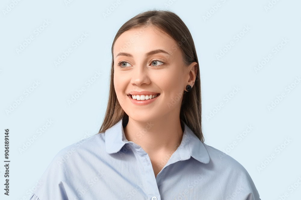 Beautiful woman smiling on blue background, closeup Beautiful woman smiling on blue background, closeup