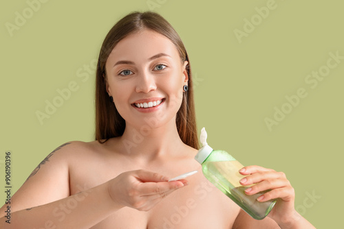 Beautiful woman with bottle...
