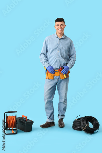Young male electrician with...