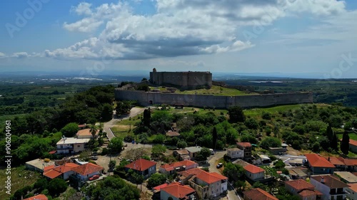 Side view of the Chlemoutsi Castle Museum on a hill besides the town with the red roofs, Greece, slow motion and copy space photo