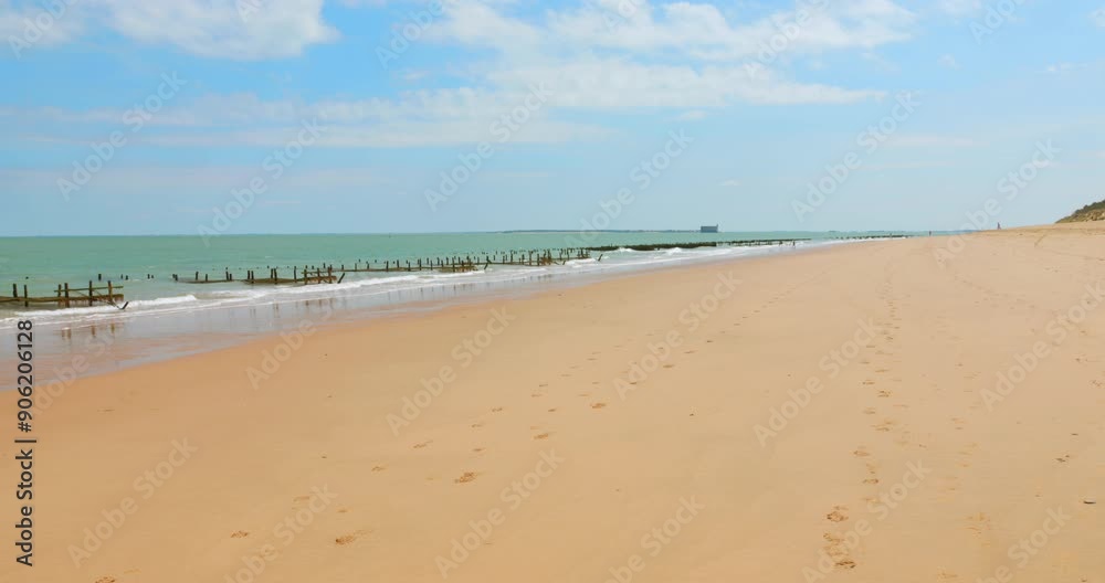 Sunny Shoreline Of Oléron Island Beach With Fort Boyard In Distance On West Coast France. Wide Shot Sunny Shoreline Of Oléron Island Beach With Fort Boyard In Distance On West Coast France. Wide Shot