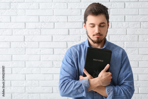 Young man with Holy Bible p...