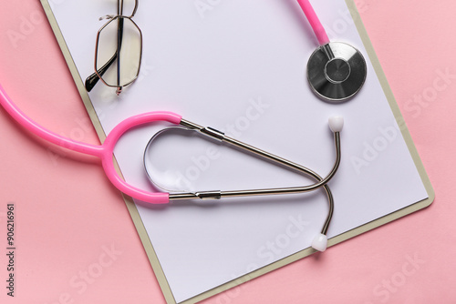 Pink stethoscope and eyegla...