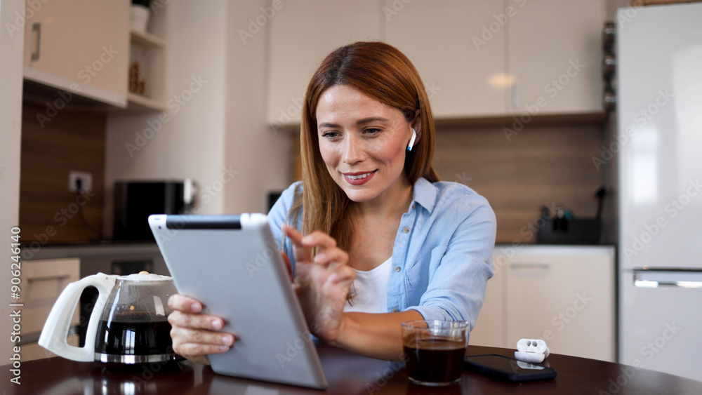 Beautiful woman searching the web on a tablet Beautiful woman searching the web on a tablet