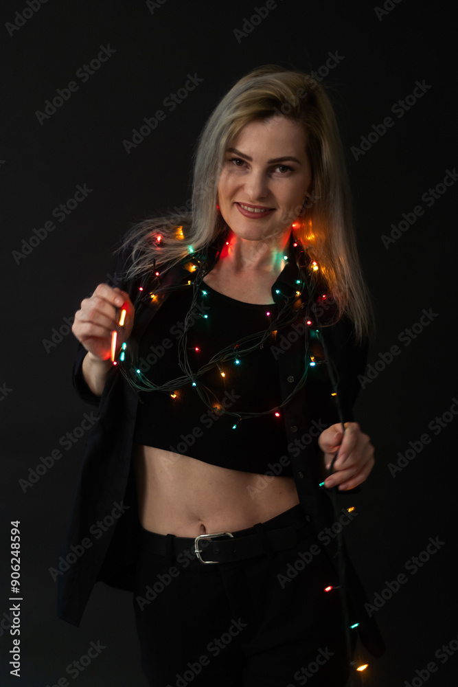 Beautiful blonde woman on black background