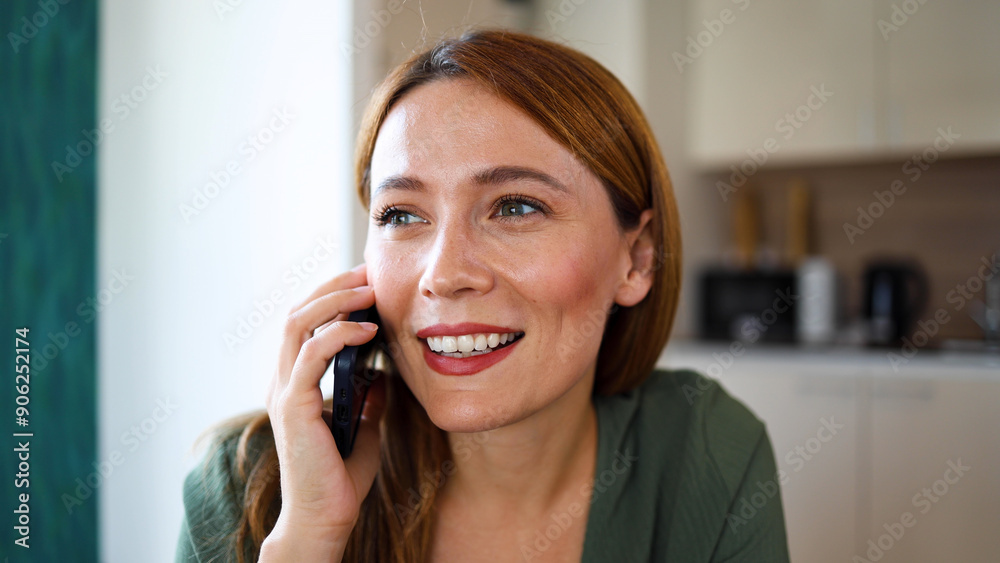 Beautiful woman relaxing at home and talking on mobile phone Beautiful woman relaxing at home and talking on mobile phone