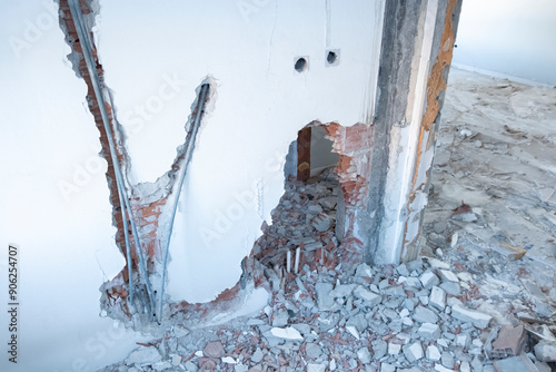 Quadro su tela Ruined house with some parts of the walls collapsedwindows were removed for demolition