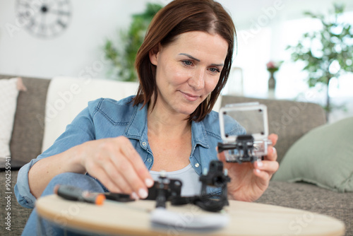 woman holding waterproof case for actioncam photo