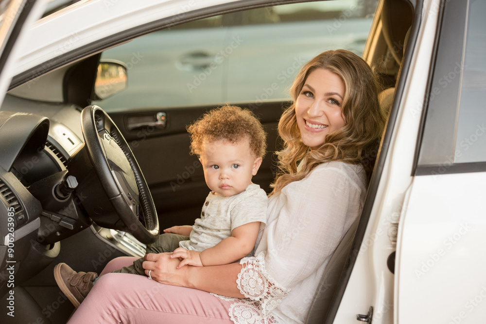 Mother and son sitting in drivers seat of car Mother and son sitting in drivers seat of car