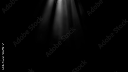 White rays of light in smoke on a black background shine from the top of the frame down. Isolated animation of white light rays. Looping animation of light. Seamless animation of light rays.