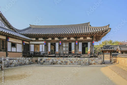 Bukseong-dong, Jung-gu, Incheon, South Korea - October 27, 2022: Autumnal view of yard and tile-roofed house with window door and room at Wolmi Park
 photo