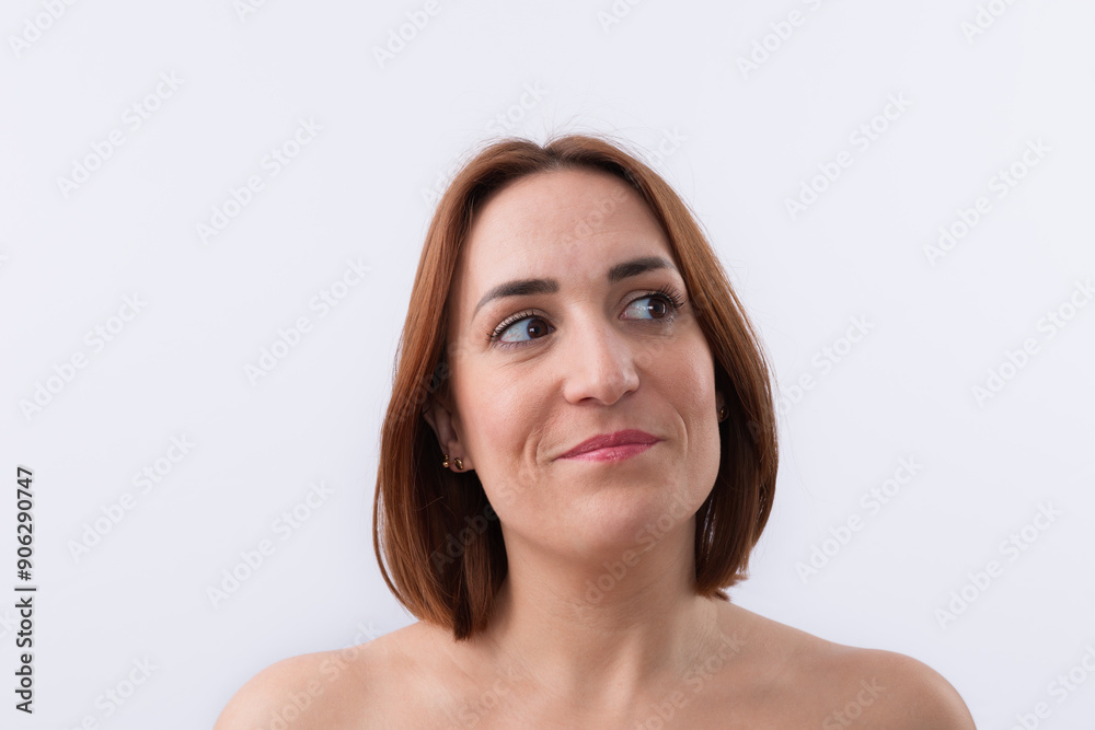 Portrait of beautiful 30 years old caucasian woman with short red hair looking to the side smiling isolated on white background. Copy space. Natural beauty concept Portrait of beautiful 30 years old caucasian woman with short red hair looking to the side smiling isolated on white background. Copy space. Natural beauty concept