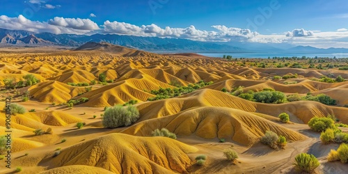 Yellow sand hills in nature reserve on south coast of Issyk Kul with deep blue sky in Kyrgyzstan photo