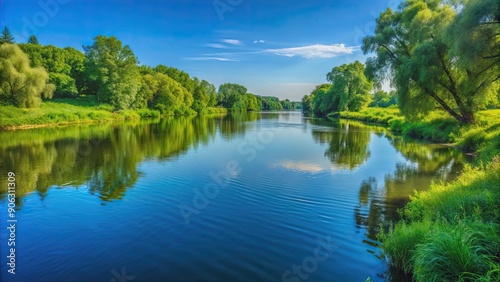 Serene river view with a lush green riverbank and a clear blue sky, river, view, landscape, nature, serene, peaceful