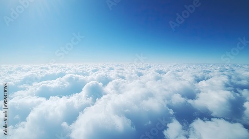 Clear blue sky with ornamental cumulus clouds, panoramic shot from an airplane featuring a close-up of the wing, ideal for travel ads.