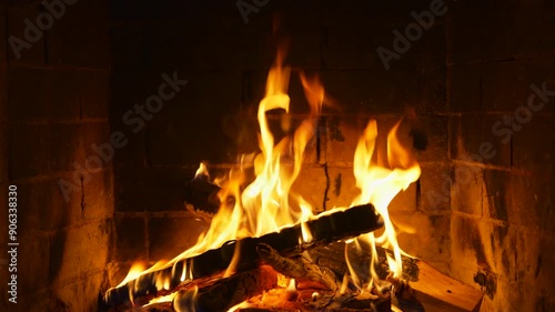 The Real Flames of Burning Logs in a Fireplace. Cozy Atmosphere. A Video for Meditation, Background, or Screensaver for a TV or LCD Panel. Relaxing Fire photo