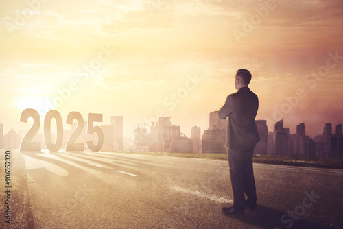 Картината върху платно caucasian businessman standing on the road and looking ahead to new year 2025