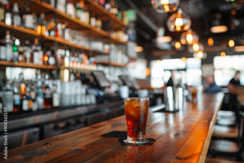 Cozy Bar Interior With Dark Drink and Bottles on Shelves in Evening Light