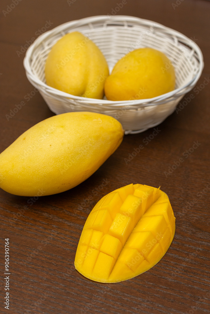 Delicious ripe juicy mangos on wooden table, top view Delicious ripe juicy mangos on wooden table, top view