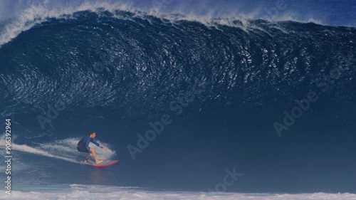 Tracking follows surfer gliding effortless at base of heavy wave pulling into deep barrel, Cloudbreak Fiji