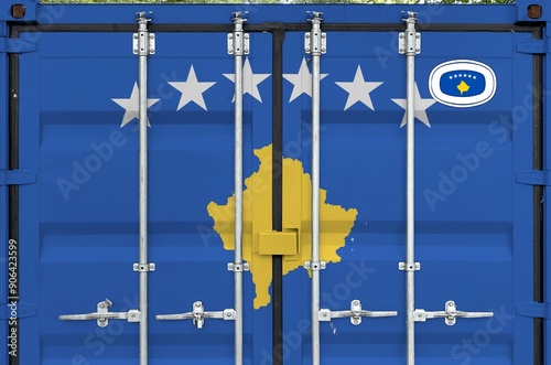 Kosovo flag depicted on metal doors of shipping cargo container outdoors in docks area close up photo