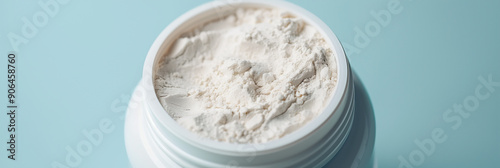 Protein Powder in White Jar on Blue Background