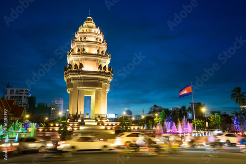 Phnom Penh Independence Monument by Night, Cambodia (Vimean Ekareach) – Illuminated Nightscape of Historic Landmark Celebrating National Freedom and Cultural Heritage in Southeast Asia photo